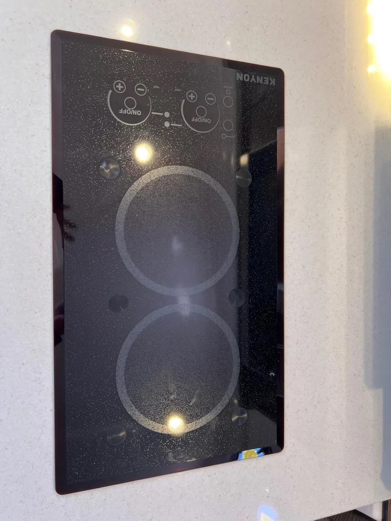 Slide: The Image of Kenyon electric cooktop on 2017 Pursuit OS 355 Offshore boat. - 35