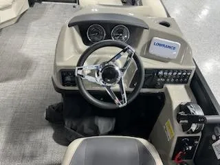 Slide: The Image of 2024 Barletta ARIA 20QC boat dashboard with steering wheel and Lowrance display. - 10