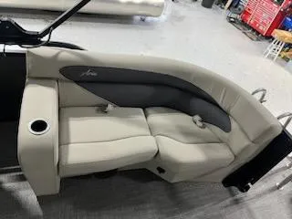 Slide: The Image of 2024 Barletta ARIA 20QC boat interior with beige seating and cup holder. - 11