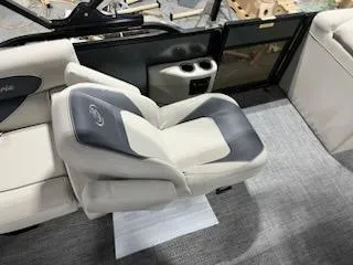 Slide: The Image of Barletta ARIA 20QC 2024 boat interior with plush seating and cup holders. - 13