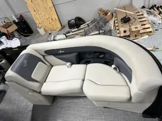 Slide: The Image of 2024 Barletta ARIA 20QC boat interior seating in a workshop. - 7