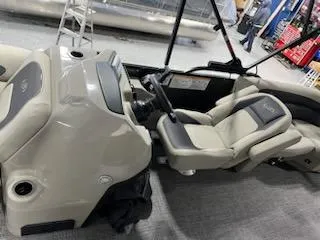 Slide: The Image of 2024 Barletta ARIA 20QC boat interior with beige and gray seating. - 9