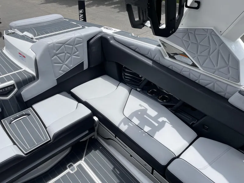 Slide: The Image of 2023 Nautique Super Air Nautique G23 Paragon interior seating area with premium upholstery. - 10