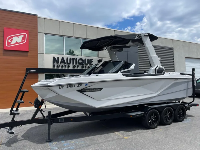 Slide: The Image of 2023 Nautique Super Air Nautique G23 Paragon boat on a trailer outside dealership. - 3