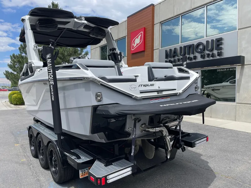 Slide: The Image of 2023 Nautique Super Air Nautique G23 Paragon boat on trailer outside dealership. - 4