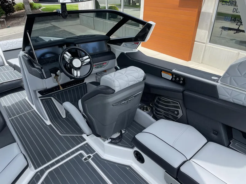 Slide: The Image of 2023 Nautique Super Air Nautique G23 Paragon interior with modern dashboard and luxurious seating. - 7