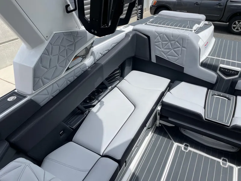 Slide: The Image of 2023 Nautique Super Air Nautique G23 Paragon interior seating with premium upholstery. - 8