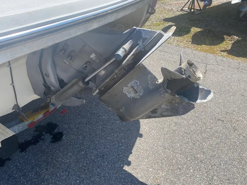 Slide: The Image of Damaged propeller of a 2005 Stingray 195 LS/LX boat on a trailer. - 2