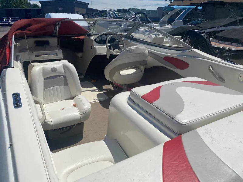 Slide: The Image of 2005 Stingray 195 LS/LX boat interior with white and red seating. - 3