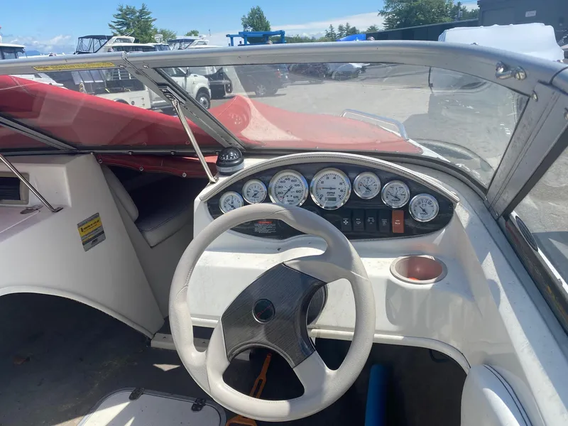 Slide: The Image of 2005 Stingray 195 LS/LX boat dashboard with steering wheel and gauges. - 6