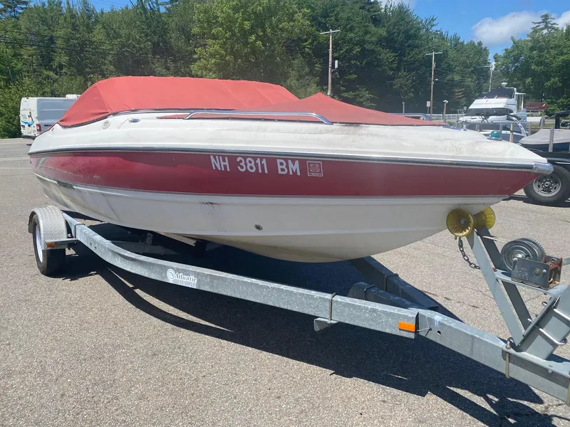 Slide: The Image of 2005 Stingray 195 LS/LX boat with red cover on trailer. - 7