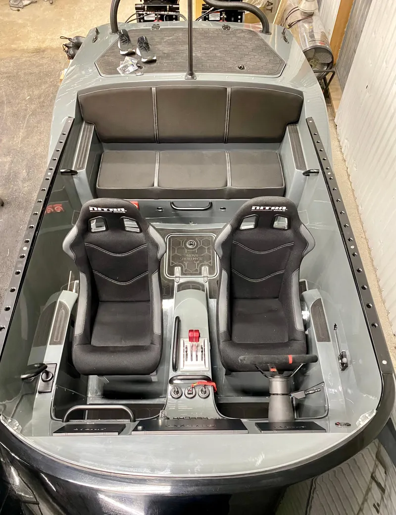 Slide: The Image of 2021 Nitra Boats 29 interior with dual racing seats and sleek design. - 2