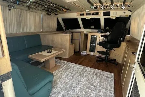 Slide: The Image of Interior of 1997 Riviera 43 Open Flybridge with seating area and captain's chair. - 21