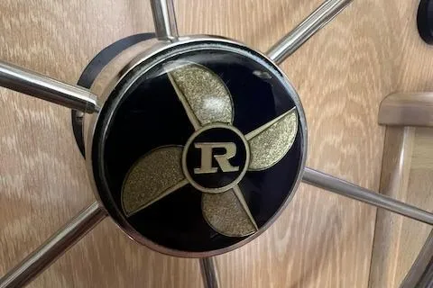 Slide: The Image of Steering wheel of a 1997 Riviera 43 Open Flybridge boat. - 27