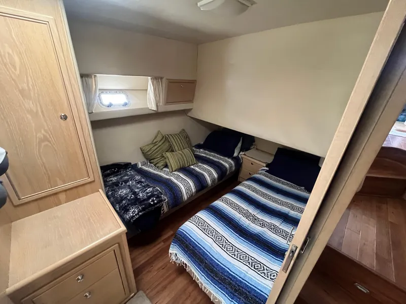 Slide: The Image of Interior of 1997 Riviera 43 Open Flybridge with twin beds. - 36