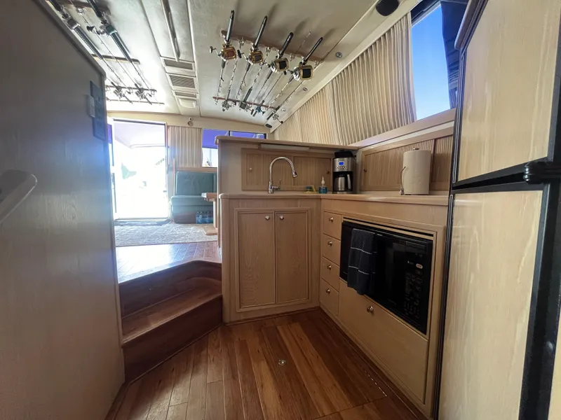 Slide: The Image of Interior of 1997 Riviera 43 Open Flybridge with modern kitchen. - 42