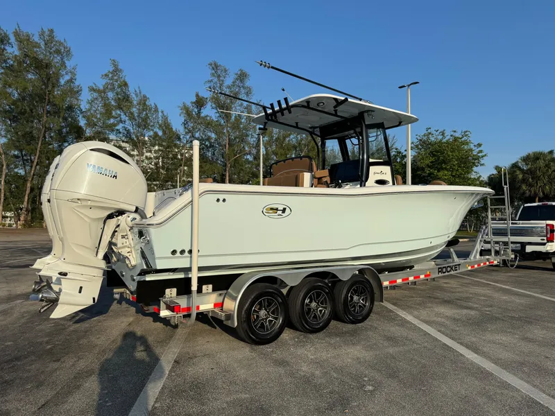 Slide: The Image of 2024 Sea Hunt Gamefish 30 Forward Seating boat on a trailer. - 2