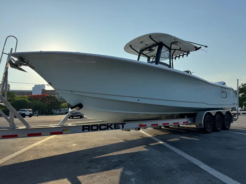 Slide: The Image of 2024 Sea Hunt Gamefish 30 Forward Seating boat on a Rocket trailer. - 6