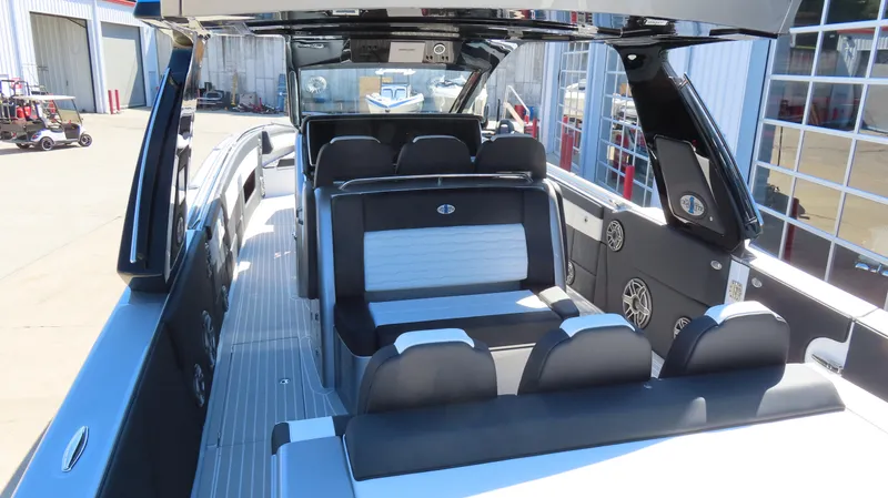 Slide: The Image of 2024 Cigarette 41 Nighthawk SD Edition luxury boat interior with seating and modern design. - 10