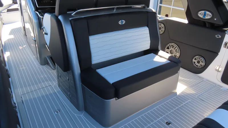 Slide: The Image of 2024 Cigarette 41 Nighthawk SD Edition boat interior seating and deck. - 12