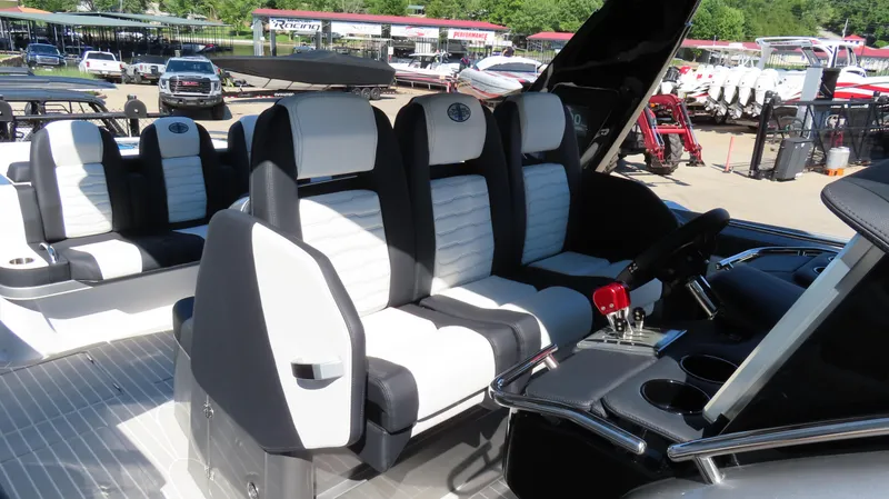 Slide: The Image of 2024 Cigarette 41 Nighthawk SD Edition boat interior with white and black seating. - 15
