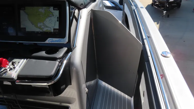 Slide: The Image of 2024 Cigarette 41 Nighthawk SD Edition boat interior with navigation system. - 16