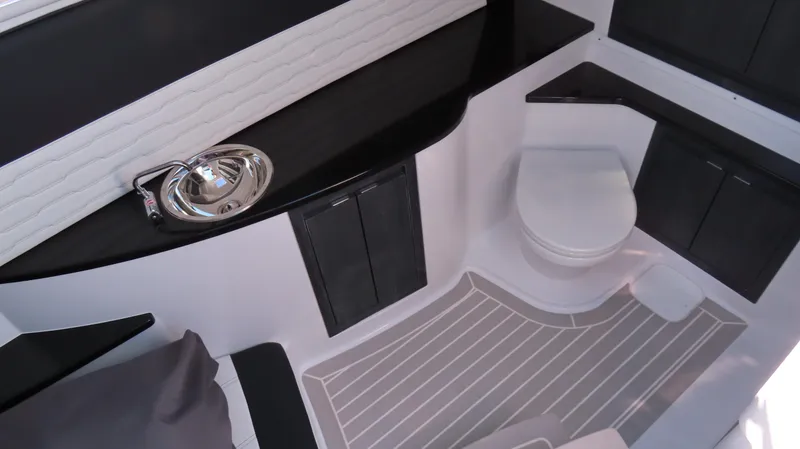 Slide: The Image of 2024 Cigarette 41 Nighthawk SD Edition boat interior with sink and toilet. - 18