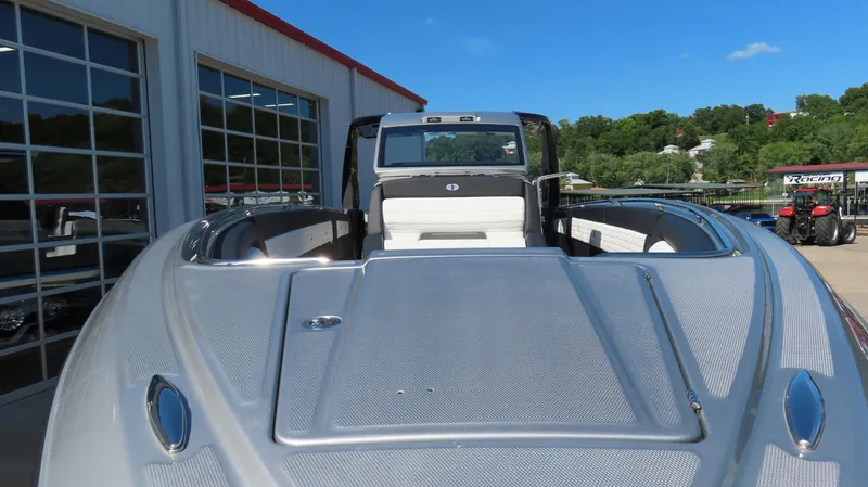 Slide: The Image of 2024 Cigarette 41 Nighthawk SD Edition boat at a marina, front view. - 2