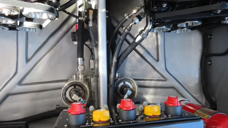 Slide: The Image of Engine compartment of 2024 Cigarette 41 Nighthawk SD Edition with control panel and hydraulic lines. - 29