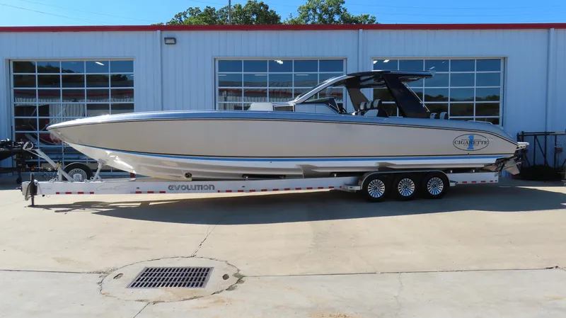 Slide: The Image of 2024 Cigarette 41 Nighthawk SD Edition boat on a trailer outside a building. - 39