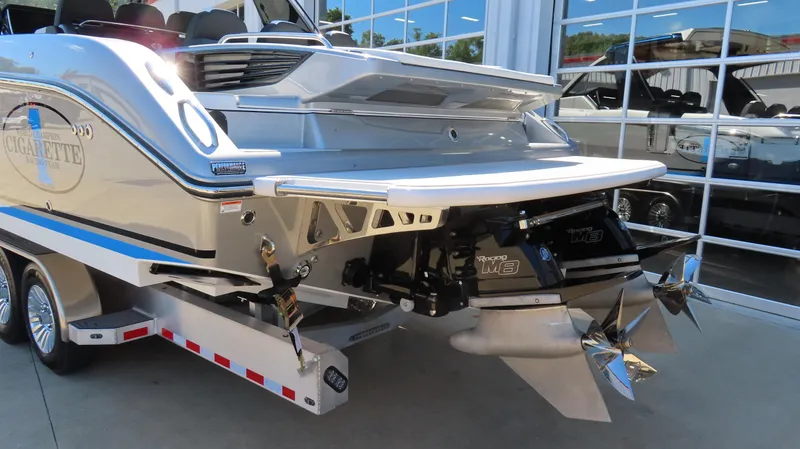 Slide: The Image of 2024 Cigarette 41 Nighthawk SD Edition boat rear view with dual propellers. - 8
