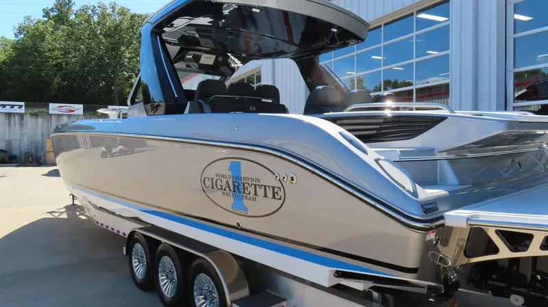 Slide: The Image of 2024 Cigarette 41 Nighthawk SD Edition boat on a trailer outside a building. - 9