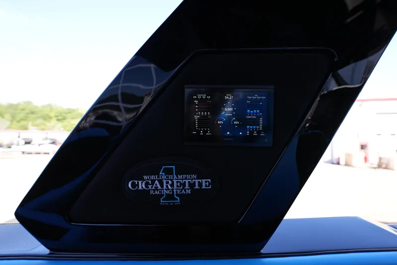 Slide: The Image of 2025 Cigarette 41 Nighthawk boat dashboard with digital display. - 12