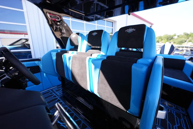 Slide: The Image of Interior seating of 2025 Cigarette 41 Nighthawk boat with blue and black upholstery. - 14