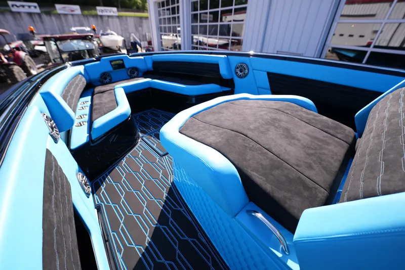 Slide: The Image of 2025 Cigarette 41 Nighthawk boat interior with blue and black seating and modern design. - 17