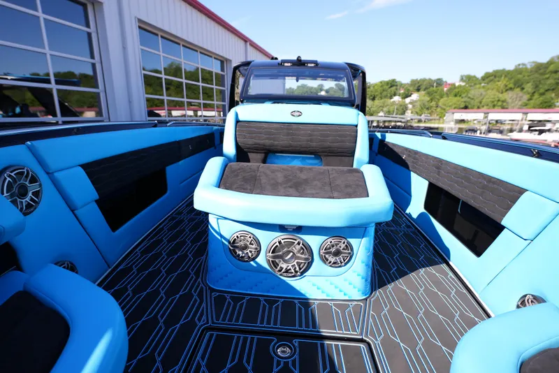 Slide: The Image of 2025 Cigarette 41 Nighthawk boat interior with blue and black seating and modern design. - 21