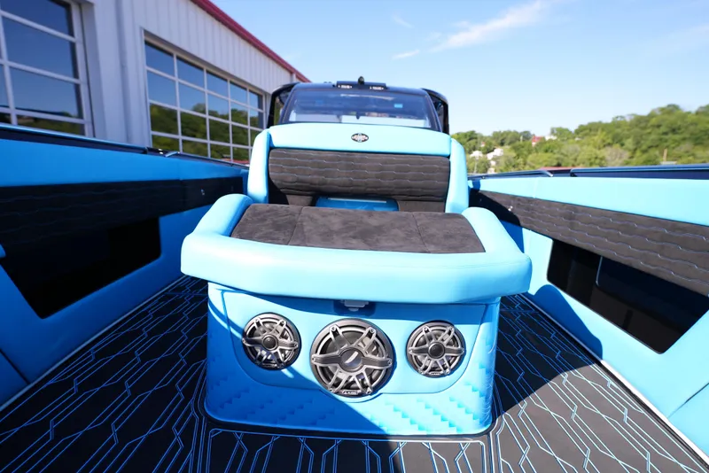Slide: The Image of 2025 Cigarette 41 Nighthawk boat with blue and black interior, featuring advanced audio system. - 22