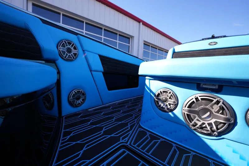 Slide: The Image of Interior of 2025 Cigarette 41 Nighthawk boat with blue upholstery and high-end speakers. - 26