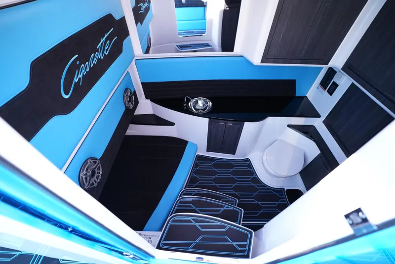 Slide: The Image of 2025 Cigarette 41 Nighthawk interior with blue and black seating and modern design. - 27