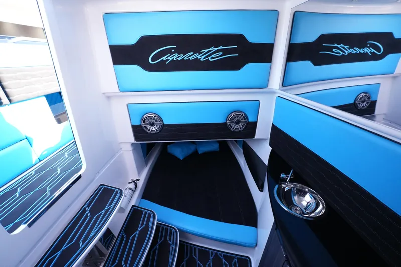 Slide: The Image of Interior of 2025 Cigarette 41 Nighthawk boat with blue and black seating. - 28