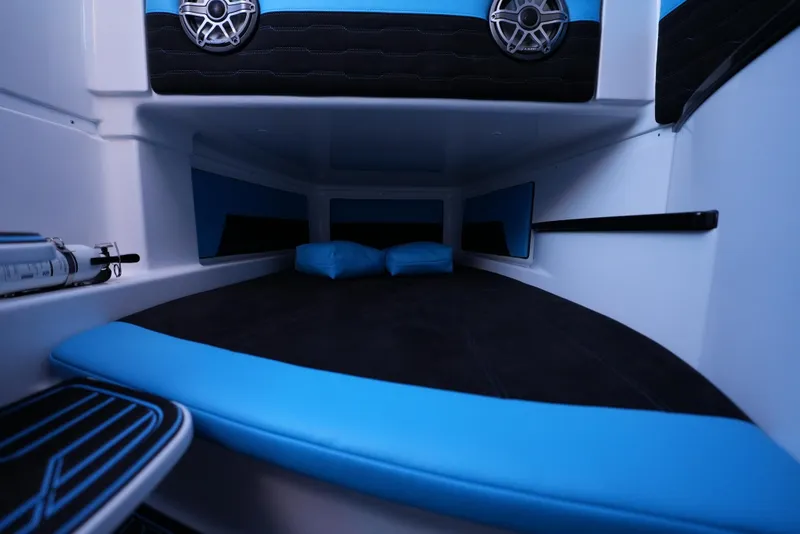 Slide: The Image of Interior cabin of 2025 Cigarette 41 Nighthawk boat with blue and black seating. - 29