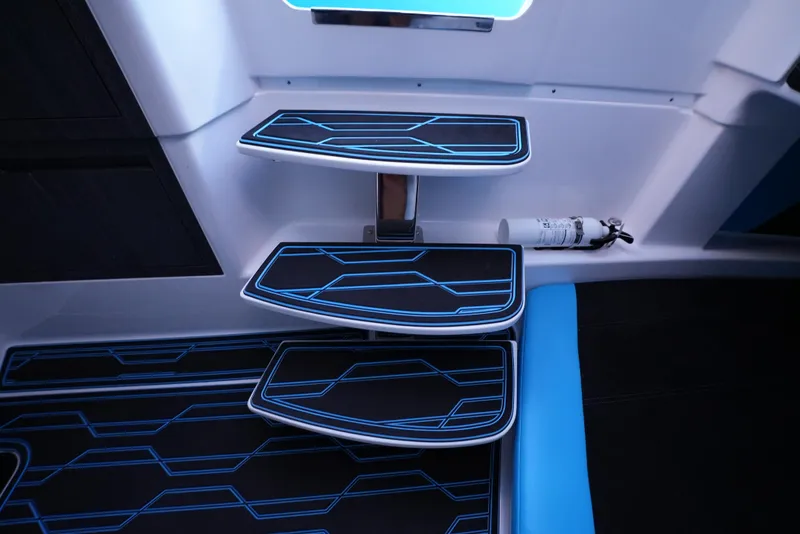 Slide: The Image of Modern interior steps of 2025 Cigarette 41 Nighthawk boat with blue LED lighting. - 32