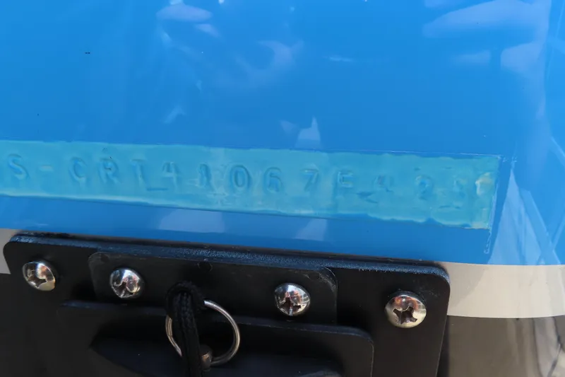 Slide: The Image of 2025 Cigarette 41 Nighthawk boat hull identification number on blue surface. - 34