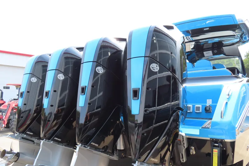 Slide: The Image of 2025 Cigarette 41 Nighthawk with four powerful outboard engines, sleek blue and black design. - 48