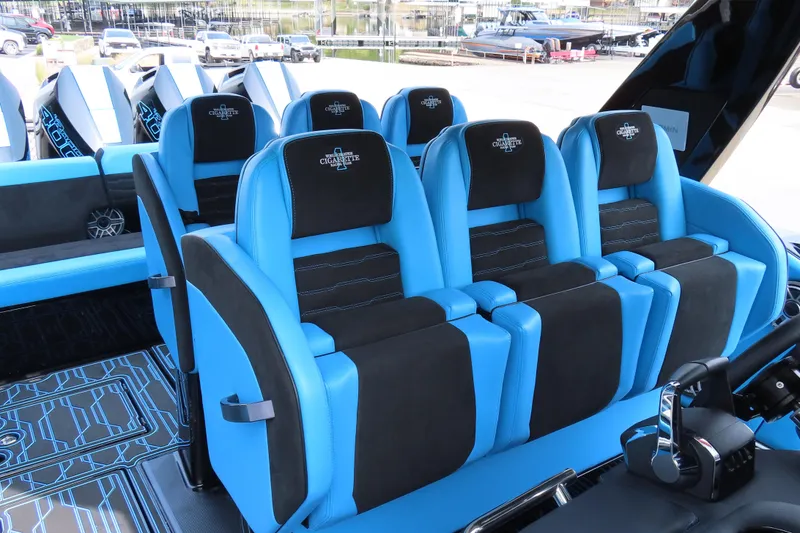 Slide: The Image of 2025 Cigarette 41 Nighthawk interior with blue and black seating, modern design. - 50