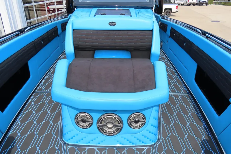 Slide: The Image of Luxurious interior of 2025 Cigarette 41 Nighthawk boat with blue and black seating. - 58