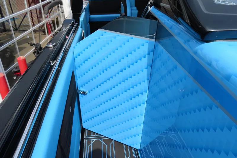 Slide: The Image of 2025 Cigarette 41 Nighthawk boat interior with blue geometric design and sleek finishes. - 60
