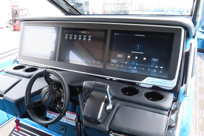 Slide: The Image of 2025 Cigarette 41 Nighthawk dashboard with advanced touchscreen controls and steering wheel. - 61