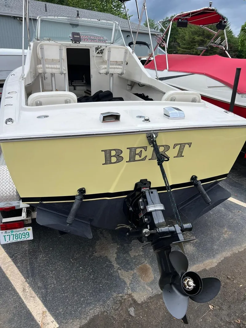 Slide: The Image of 1969 Bertram Bahia Mar 20 boat with outboard motor, parked on a trailer. - 10