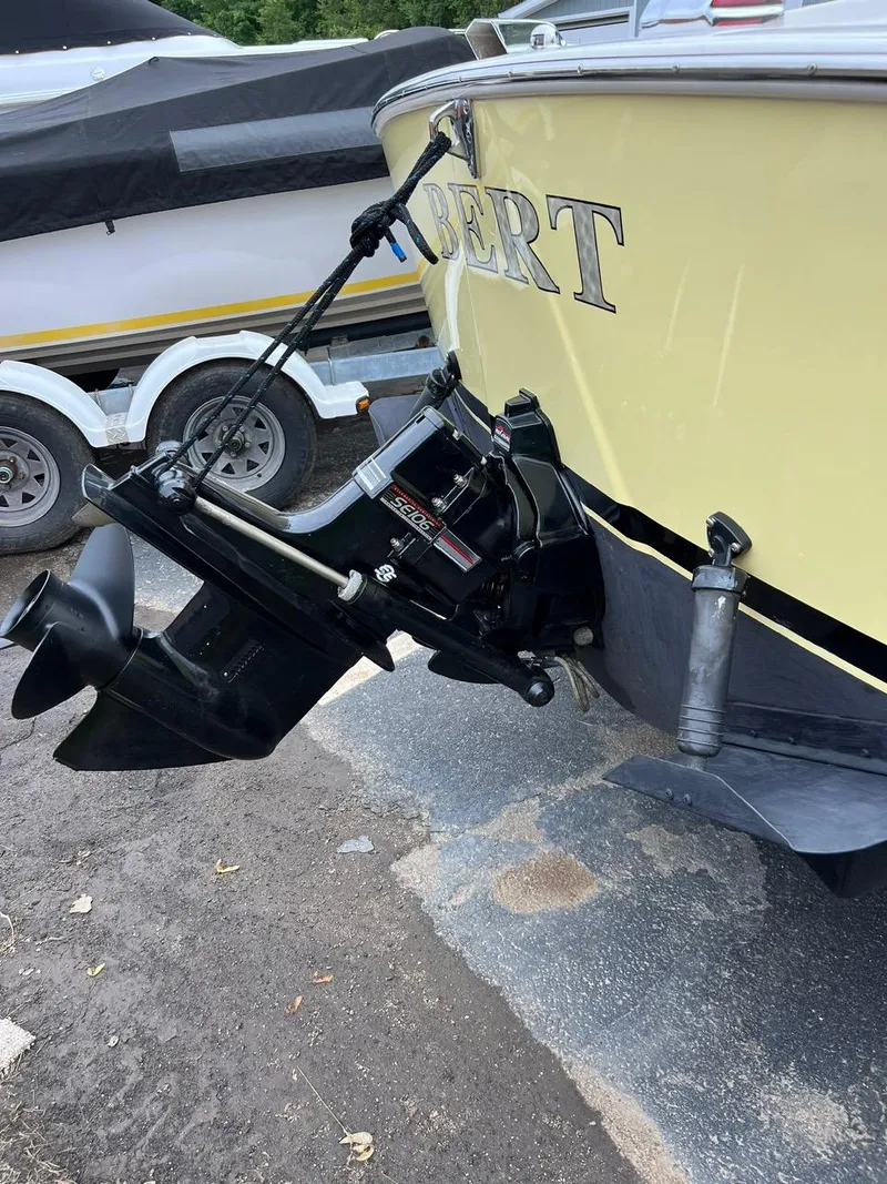 Slide: The Image of 1969 Bertram Bahia Mar 20 boat stern with outboard motor. - 11